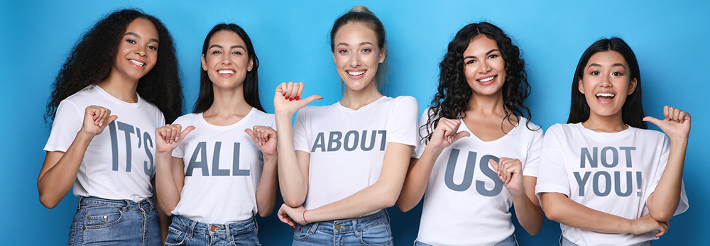 Group of young women in white tshirts