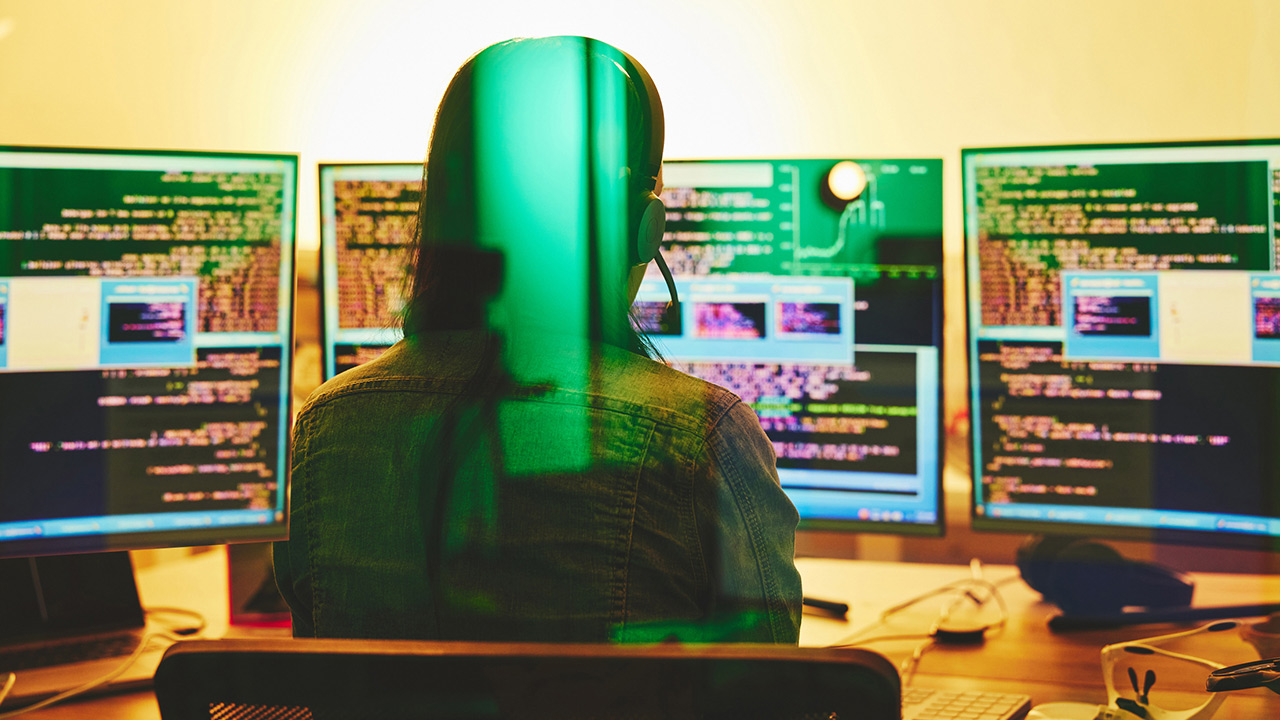 Person interviewing 3 people on 3 monitors