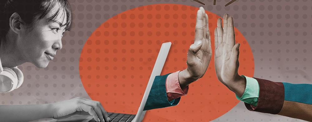 Woman on laptop with high five hands connecting
