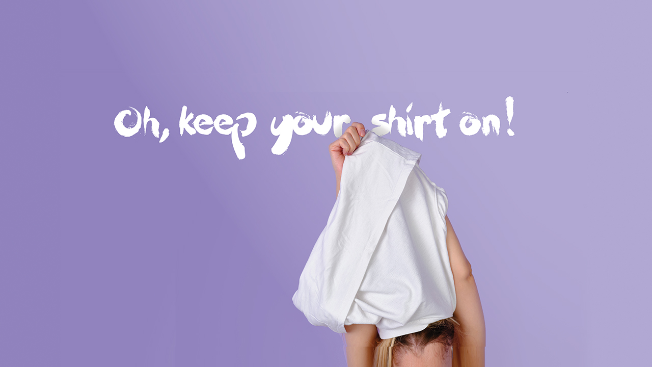 blond woman taking her t-shirt off