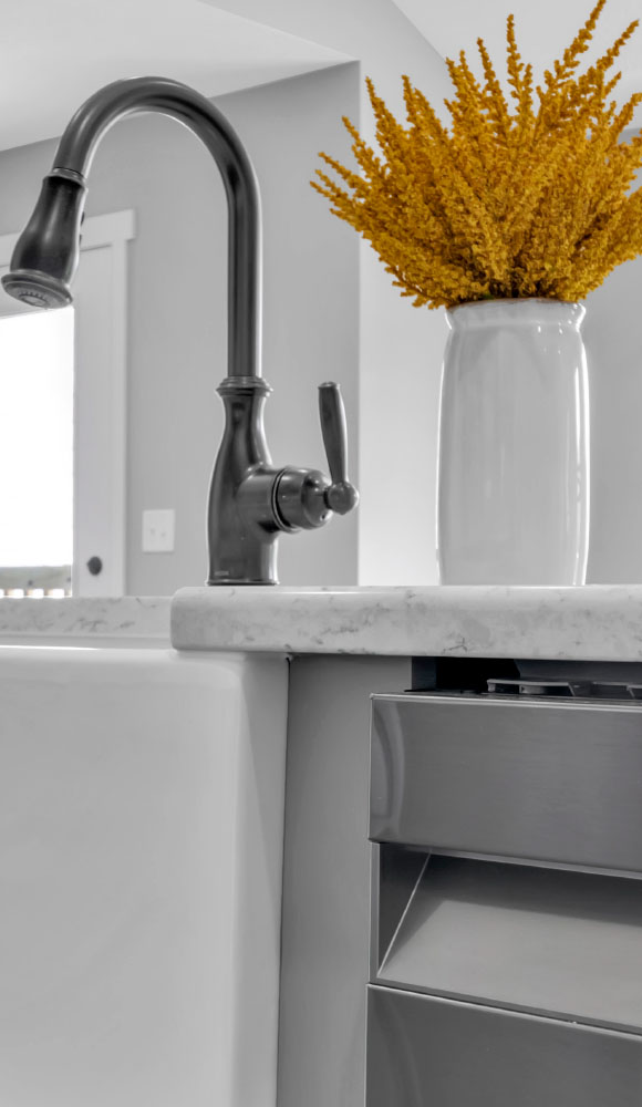 Close up of faucet and flowers from American Heritage Homes' Custom Home Builder website