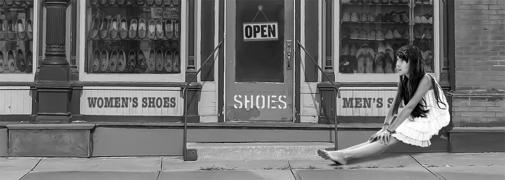 Old-time shoe store with barefoot kid outside